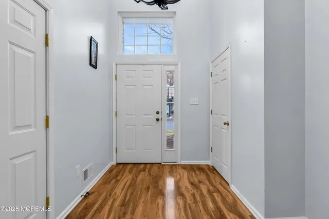 a view of bathroom with shower and hardwood floor