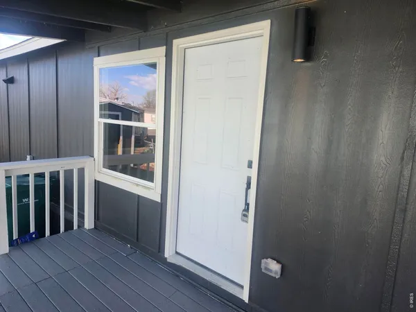 a view of an entryway door and garden