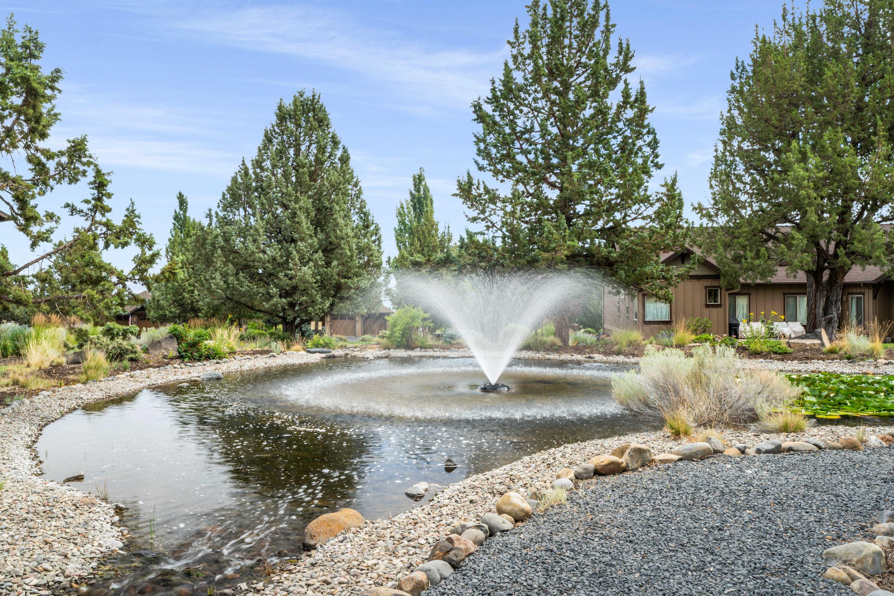 205 Vista Rim Drive Redmond, OR 97756 - Photo 37 of 85 a view of a yard with a fountain