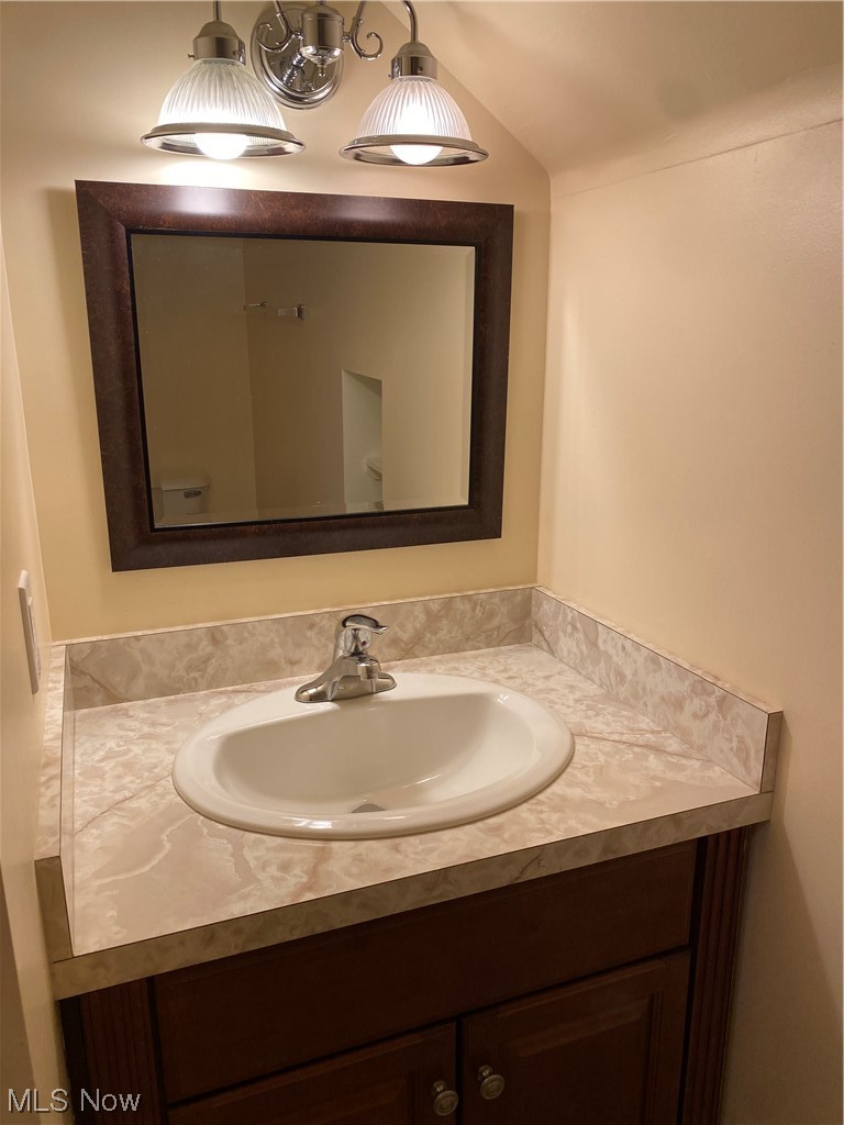 5680 Shawnee Road Cleveland, OH 44124 - Photo 12 of 21 Bathroom featuring vanity with extensive cabinet space and mirror