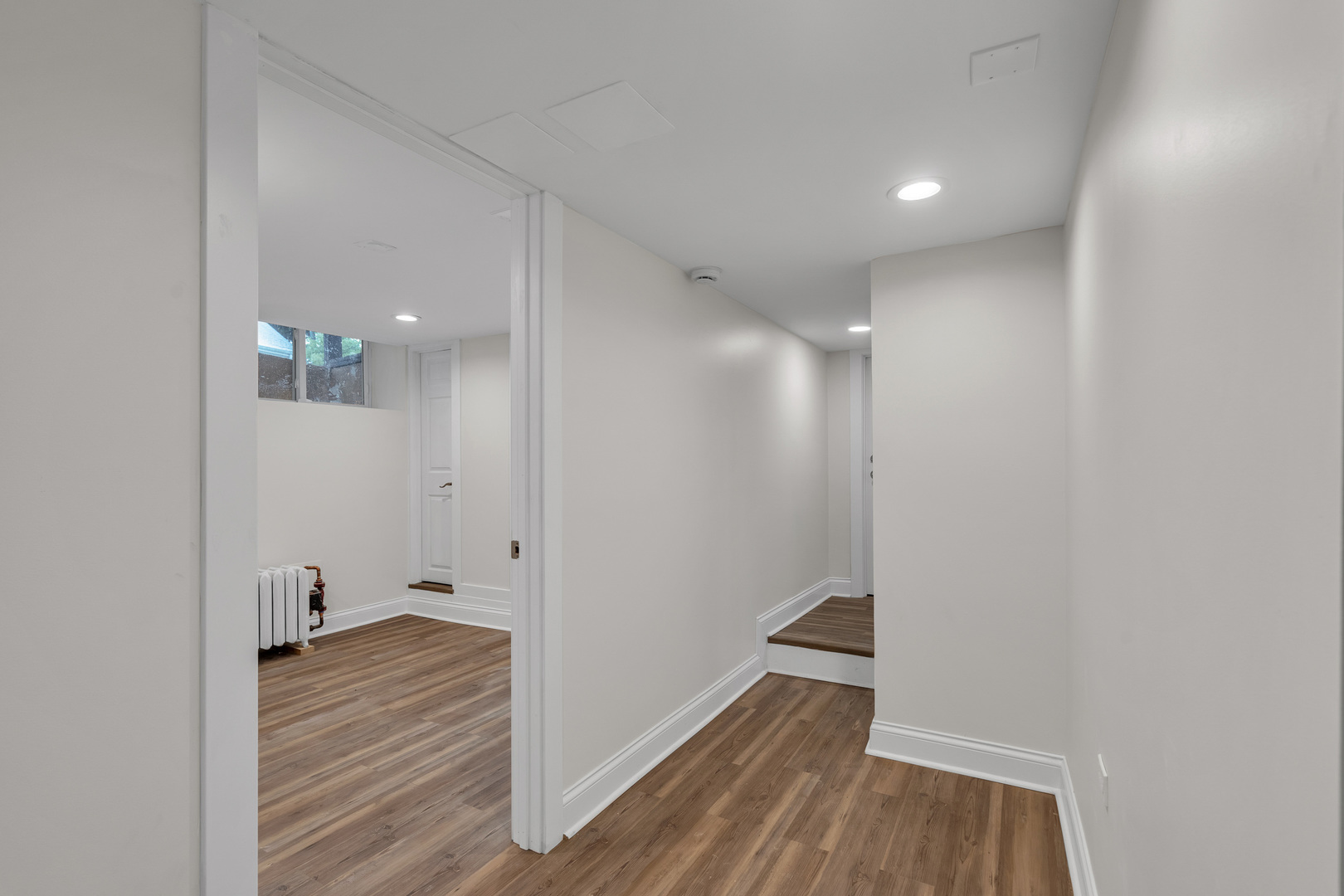 1155 St Johns Avenue, Unit H Highland Park, IL 60035 - Photo 11 of 20 a view of a hallway with wooden floor