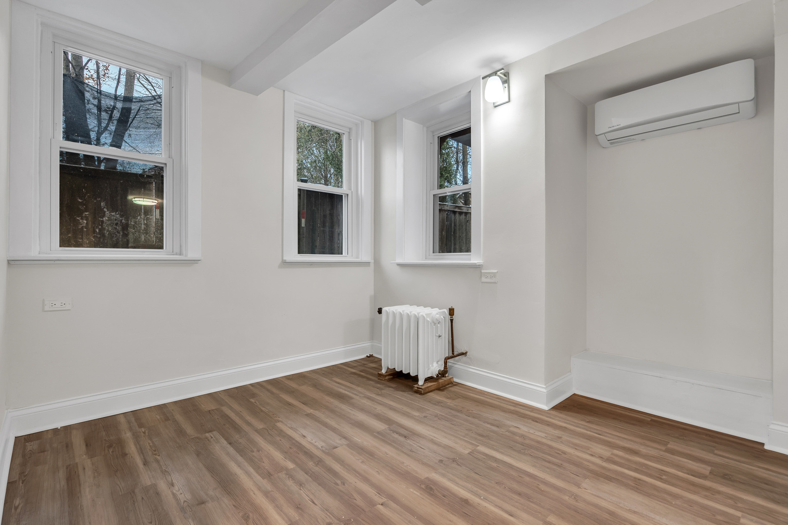 1155 St Johns Avenue, Unit H Highland Park, IL 60035 - Photo 14 of 20 a room view with wooden floor and cabinet