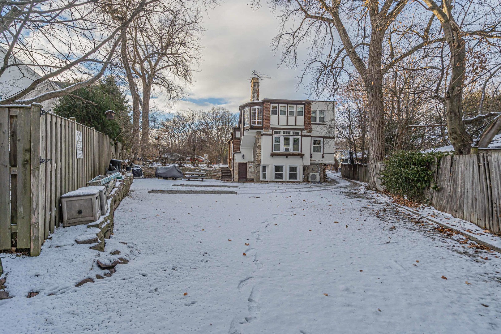1155 St Johns Avenue, Unit H Highland Park, IL 60035 - Photo 20 of 20 a view of a backyard with large trees
