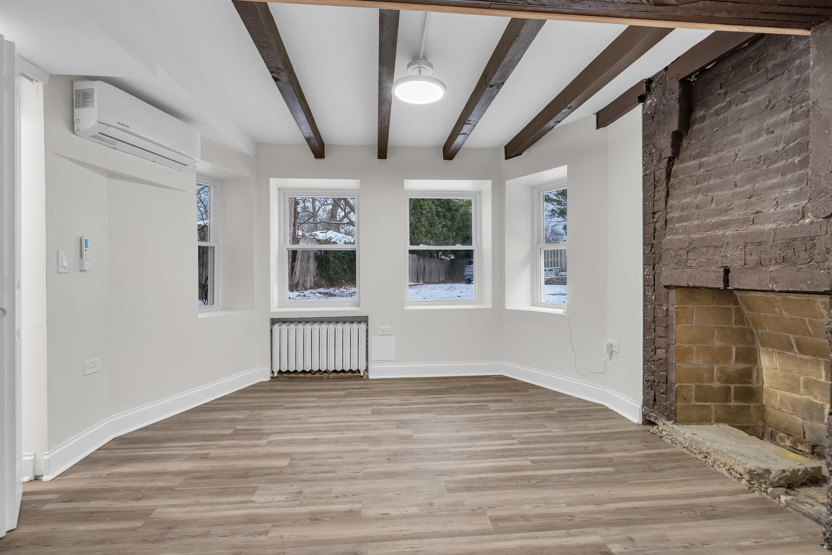 1155 St Johns Avenue, Unit H Highland Park, IL 60035 - Photo 7 of 20 a view of empty room with wooden floor