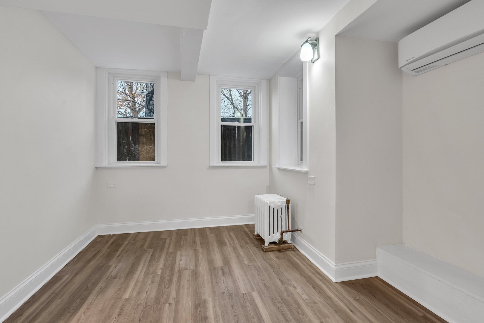 1155 St Johns Avenue, Unit H Highland Park, IL 60035 - Photo 10 of 20 a view of empty room with wooden floor and fan
