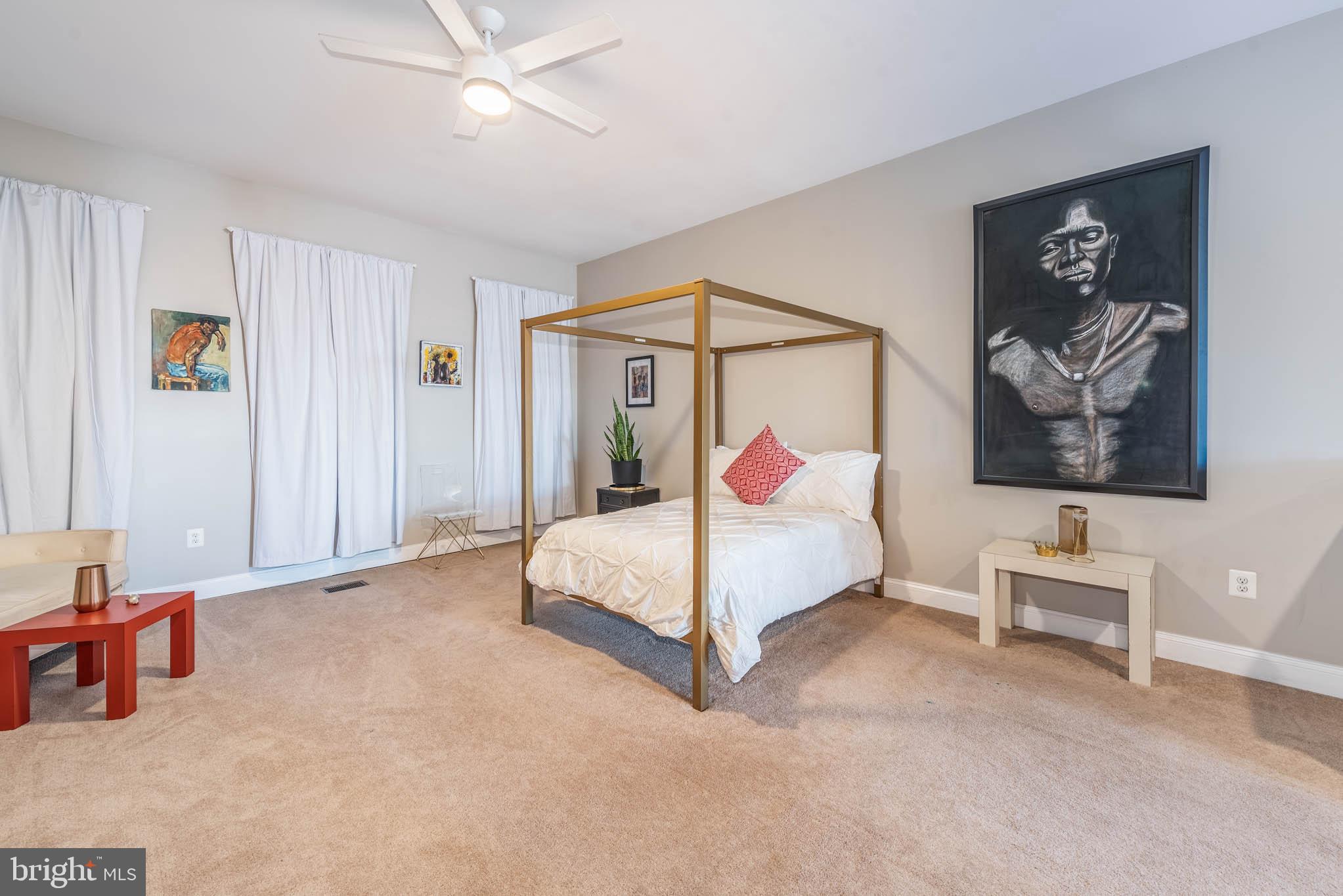 1929 McCulloh Street Baltimore, MD 21217 - Photo 23 of 39 a bedroom with a bed and a painting on the wall