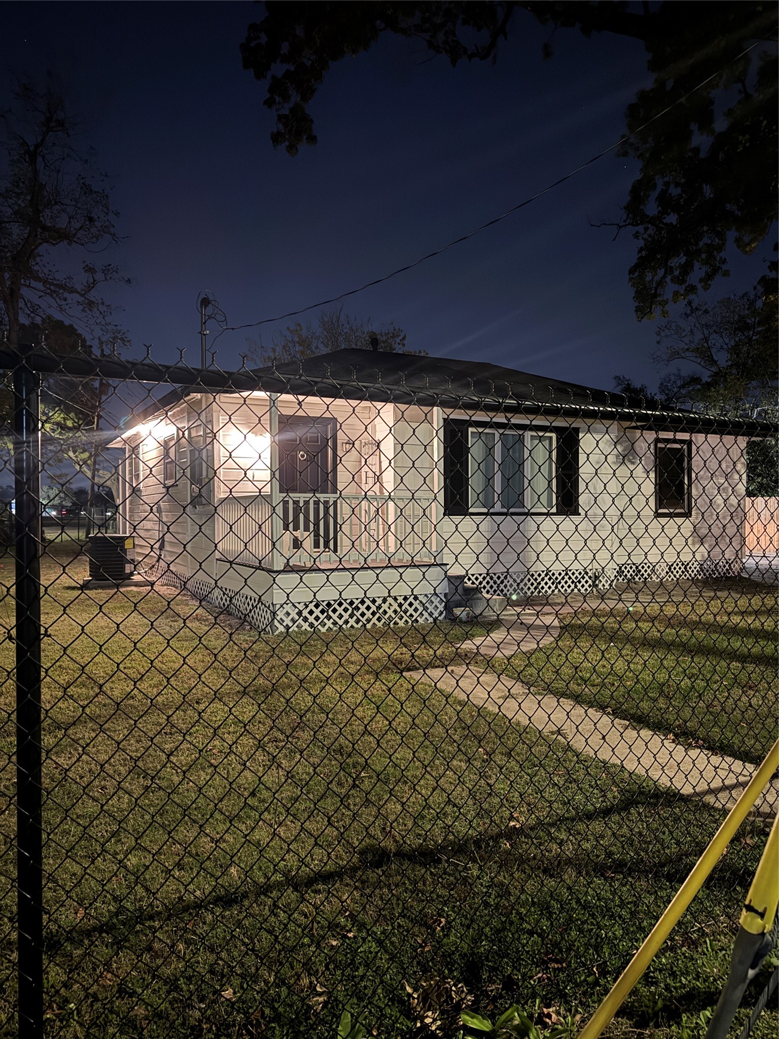 a view of a backyard of the house