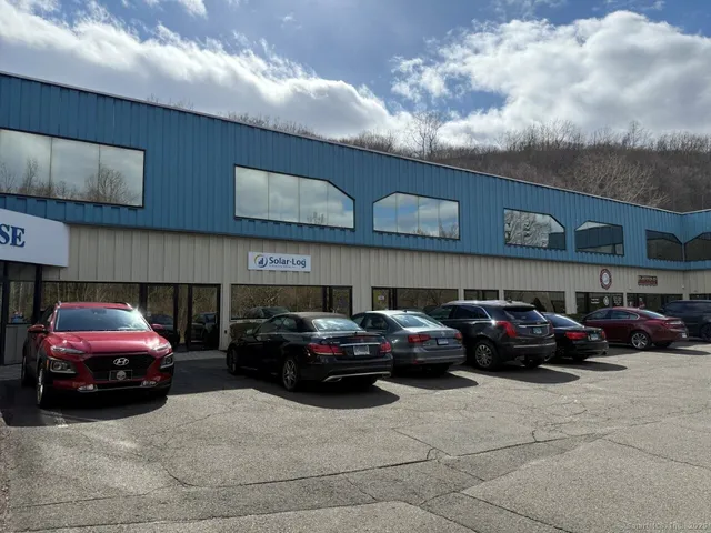 a view of a car parked in front of a building