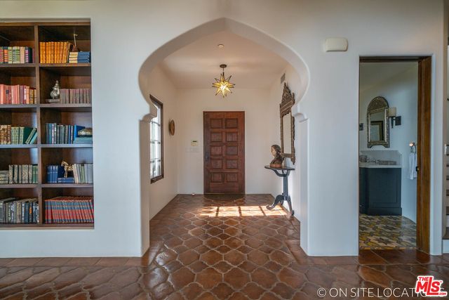a kitchen with stainless steel appliances a sink stove and cabinets