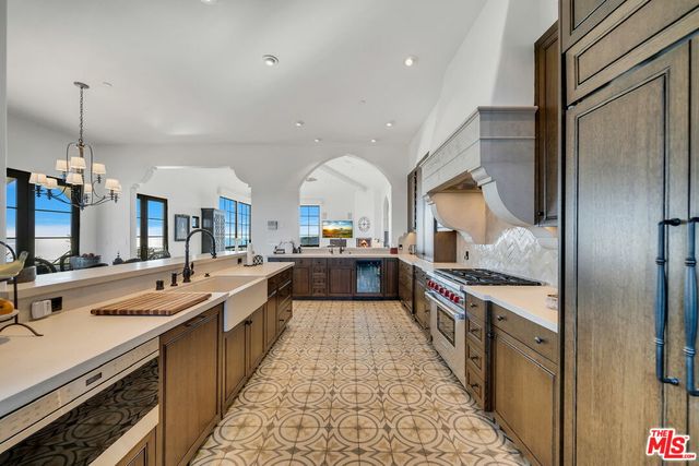 a living room with furniture a rug and a window