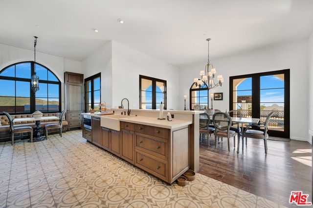 a bathroom with a tub sink shower and a mirror