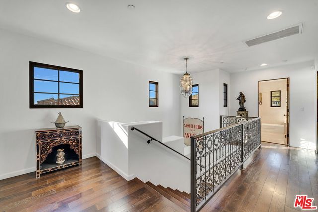 a living room with furniture and large window