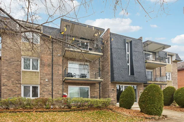 a front view of a building with balcony