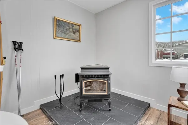 a kitchen with stainless steel appliances white cabinets a stove a sink and a microwave