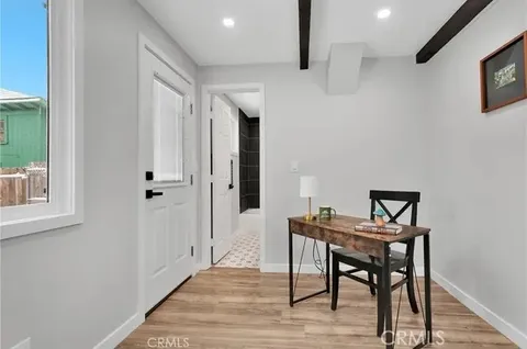 a workspace with furniture and wooden floor