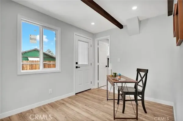 a view of an entryway with wooden floor