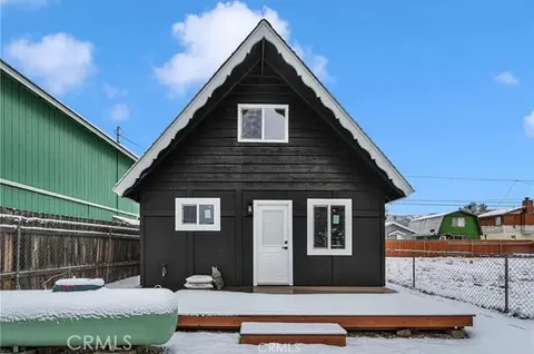 a backyard of a house with seating space