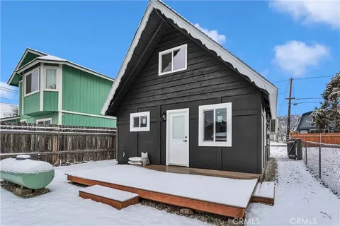 a view of roof deck with wooden fence
