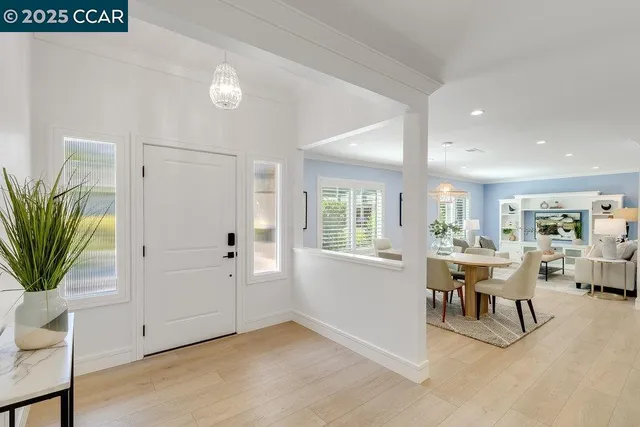 a view of a livingroom with furniture and a window
