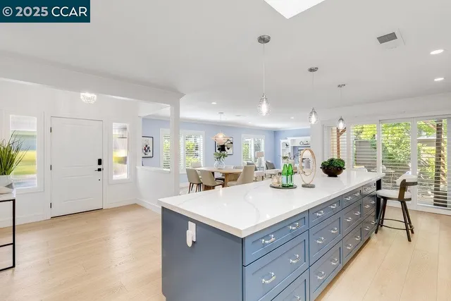 a bathroom with a sink double vanity granite and a large mirror