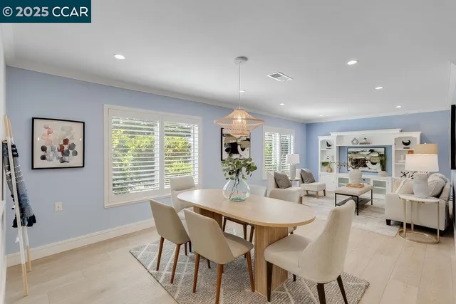 a view of a dining room with furniture window and outside view