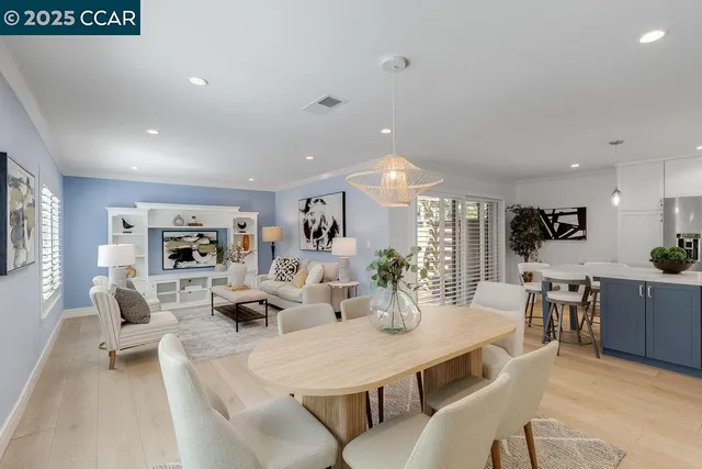 a view of a dining room with furniture window and wooden floor