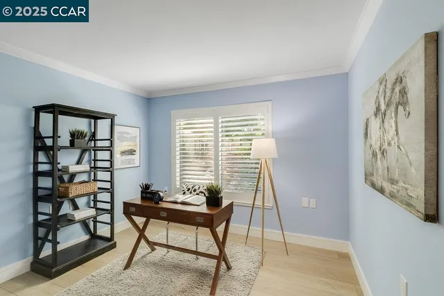 a view of a livingroom with furniture and window