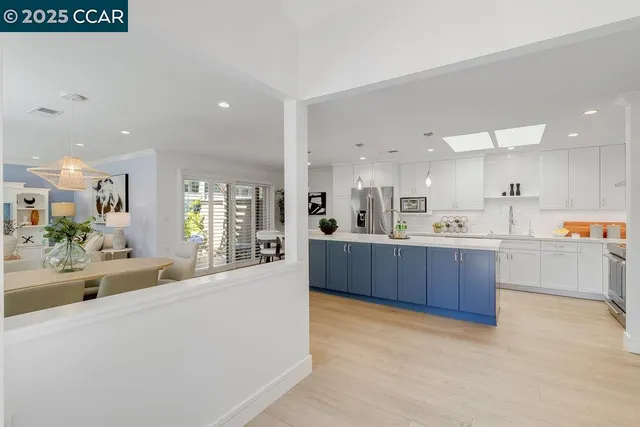 a large kitchen with stainless steel appliances lots of counter top space