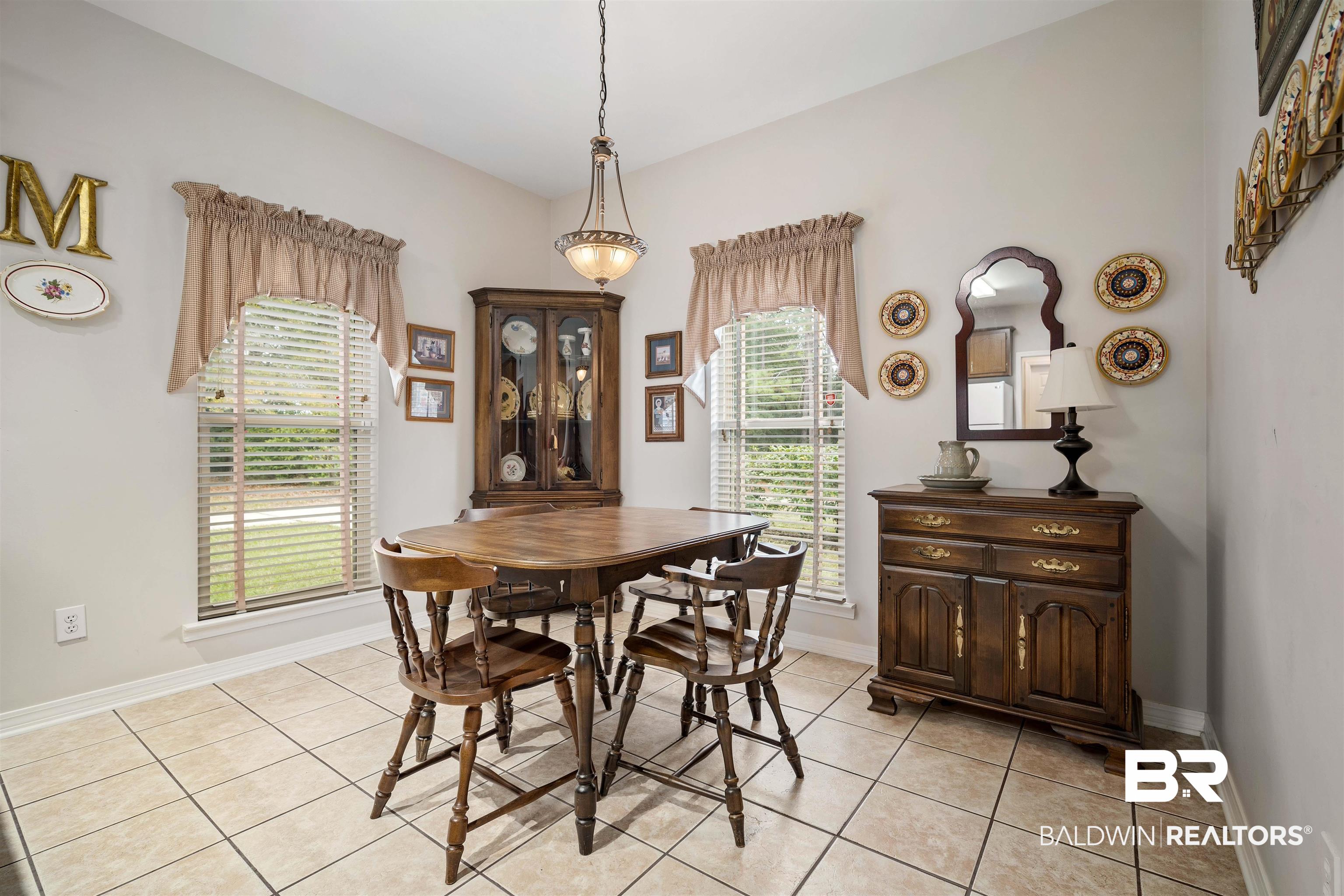 7419 Pake Road Saraland, AL 36571 - Photo 10 of 27 Dining space featuring plenty of natural light and light tile patterned floors