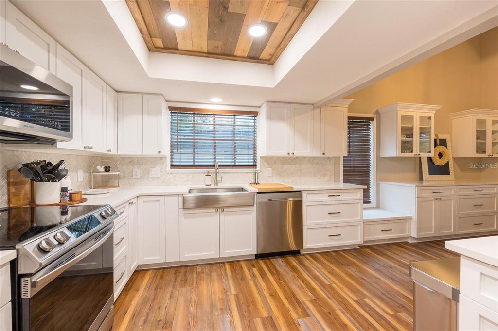 13219 Tyrone Street Hudson, FL 34667 - Photo 9 of 99 a kitchen with granite countertop a stove and a sink