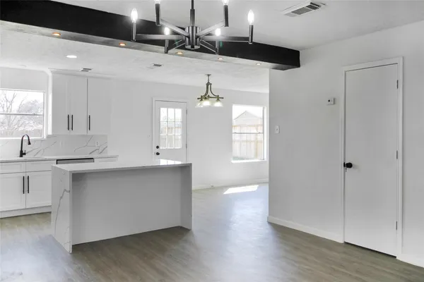 a spacious bathroom with a double vanity sink and a mirror