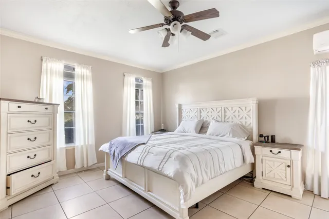 a bedroom with a bed and a dresser