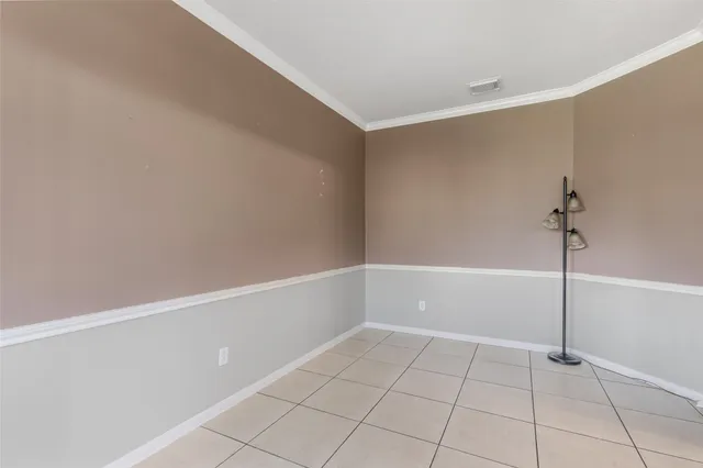 a view of an empty room with closet