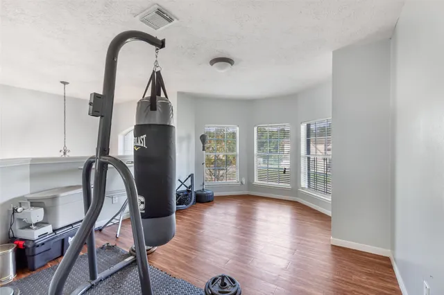a view of livingroom with furniture window and wooden floor
