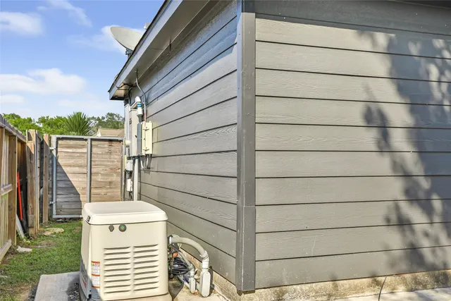 a view of a wooden door and a window