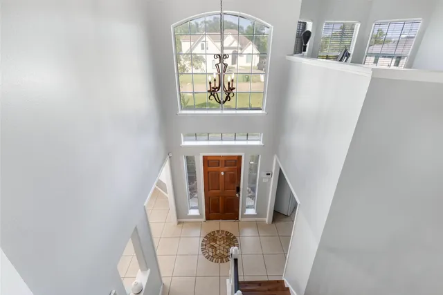 a front view of a house with wooden floor and windows