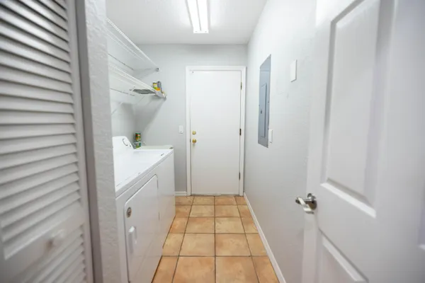 a bathroom with a tub sink and mirror