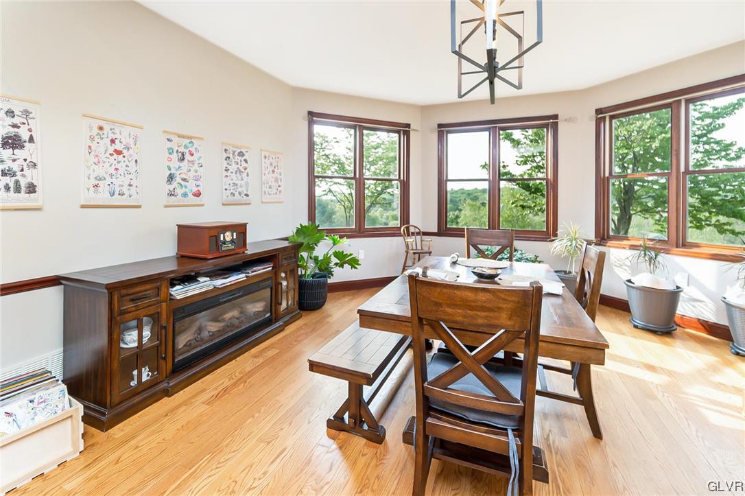 870 Stagecoach Road West Lehighton, PA 18235 - Photo 18 of 50 a living room with furniture a flat screen tv and a floor to ceiling window