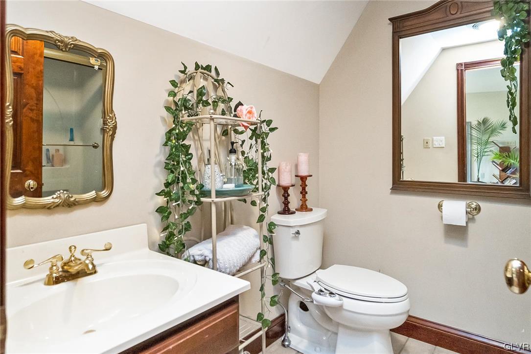 870 Stagecoach Road West Lehighton, PA 18235 - Photo 35 of 50 a bathroom with a sink mirror vanity and toilet