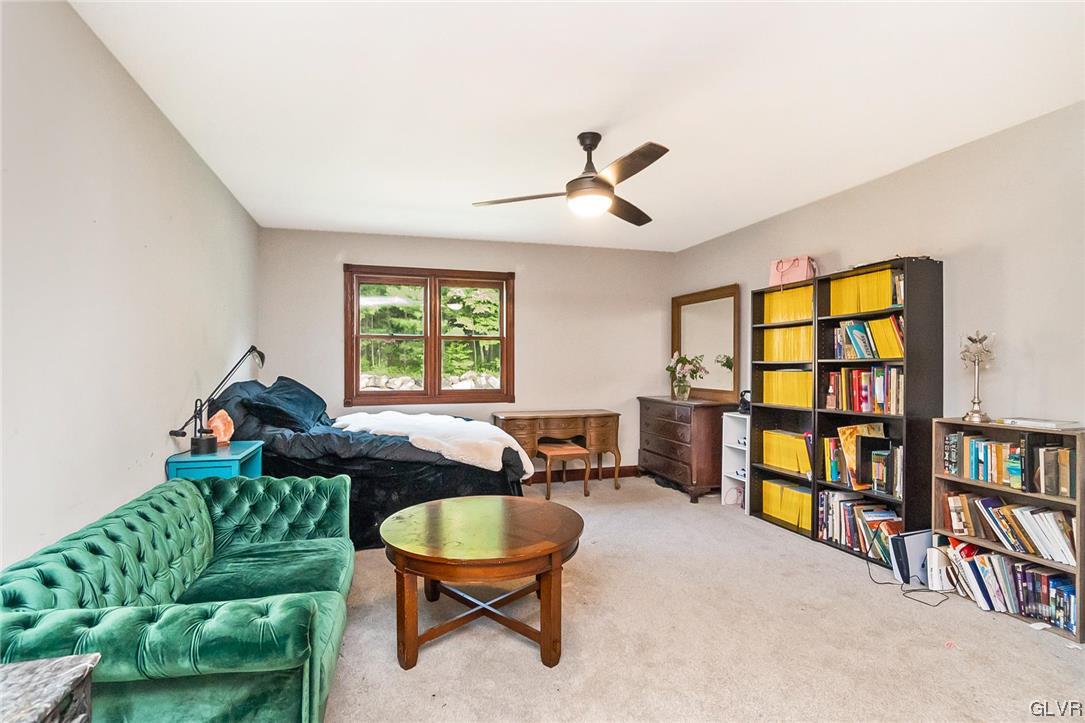 870 Stagecoach Road West Lehighton, PA 18235 - Photo 36 of 50 a living room with furniture a window and a book shelf