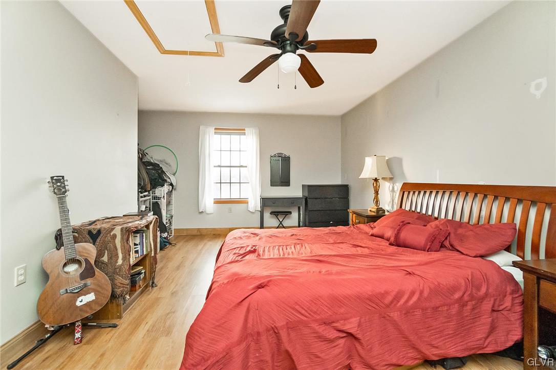 870 Stagecoach Road West Lehighton, PA 18235 - Photo 41 of 50 a bedroom with a bed and wooden floor