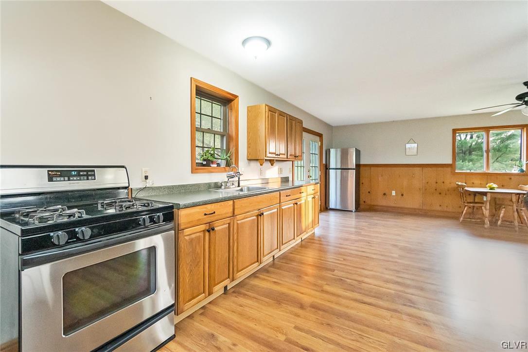 870 Stagecoach Road West Lehighton, PA 18235 - Photo 46 of 50 a large kitchen with stainless steel appliances granite countertop a stove and a sink