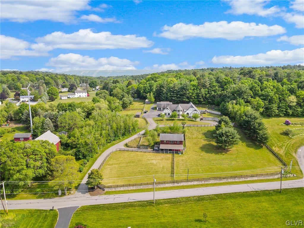 870 Stagecoach Road West Lehighton, PA 18235 - Photo 6 of 50 a view of a swimming pool with an outdoor seating a yard and mountain view in back