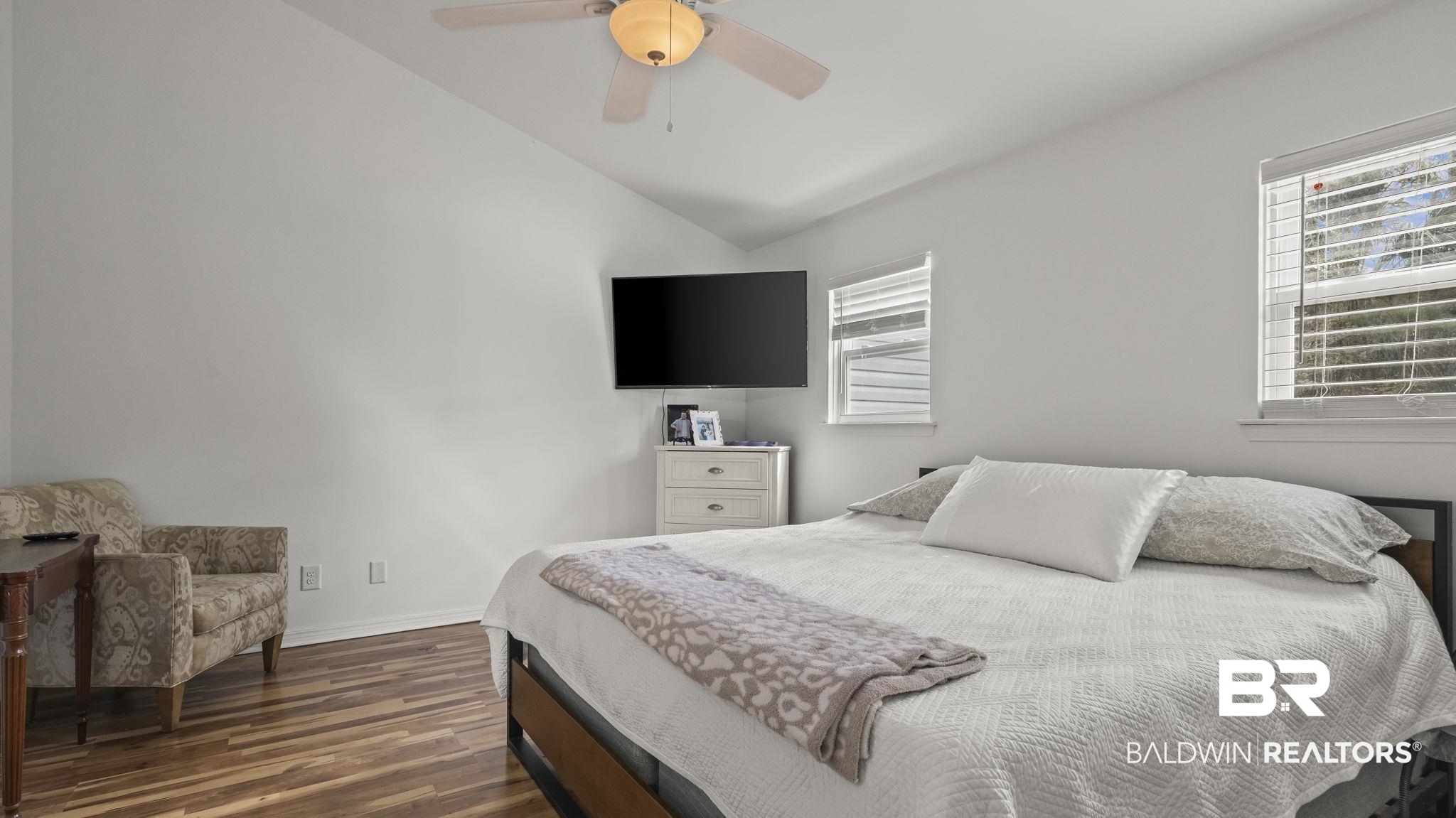 26063 Canal Road, Unit 2F Orange Beach, AL 36561 - Photo 14 of 36 Bedroom with lofted ceiling, dark wood-style floors, and ceiling fan