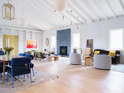 a living room with fireplace furniture and a fireplace