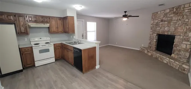 a kitchen with a stove and a microwave
