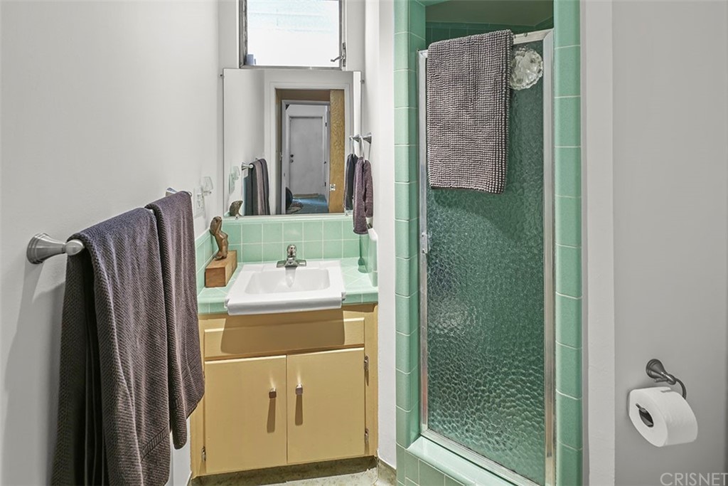 5265 Old Road Riverside, CA 92504 - Photo 16 of 75 a bathroom with a shower and mirror