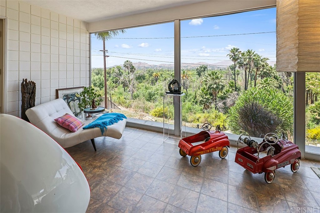 5265 Old Road Riverside, CA 92504 - Photo 27 of 75 a living room with furniture and a floor to ceiling window