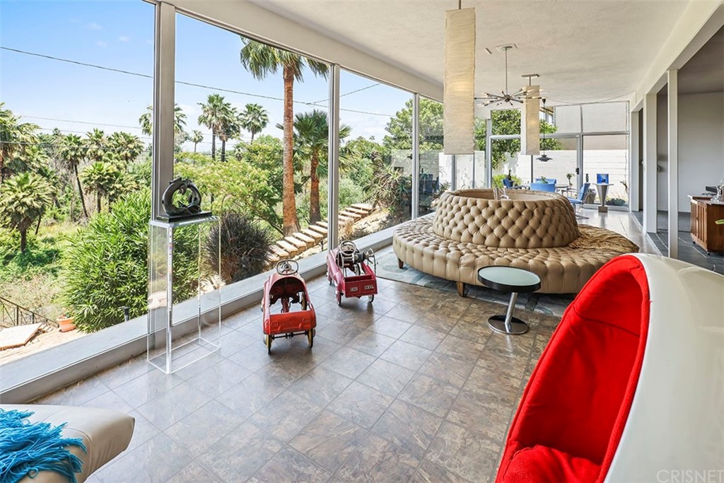 5265 Old Road Riverside, CA 92504 - Photo 28 of 75 a living room with furniture and a floor to ceiling window
