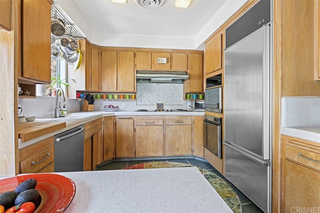 5265 Old Road Riverside, CA 92504 - Photo 38 of 75 a kitchen with a sink cabinets and stainless steel appliances